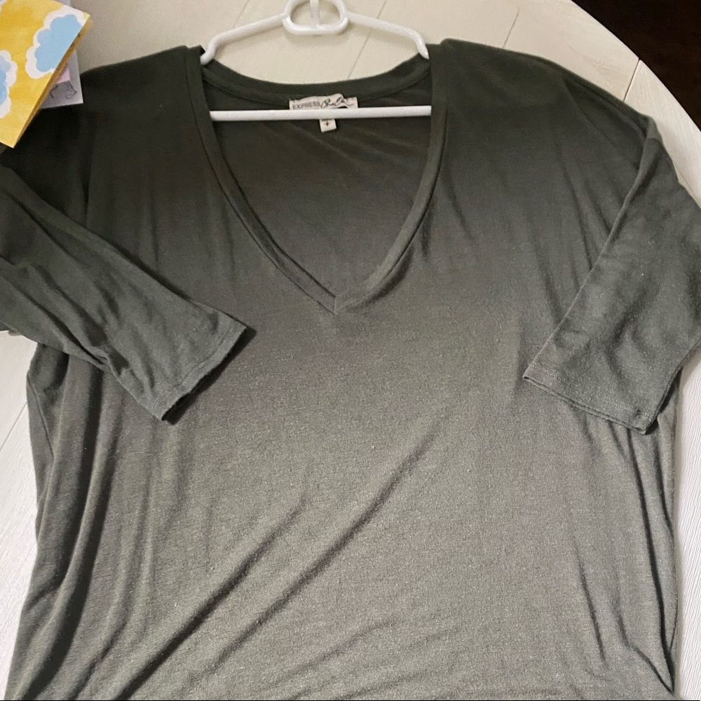 Express army green high low top with 1/4 length sleeves. Size medium